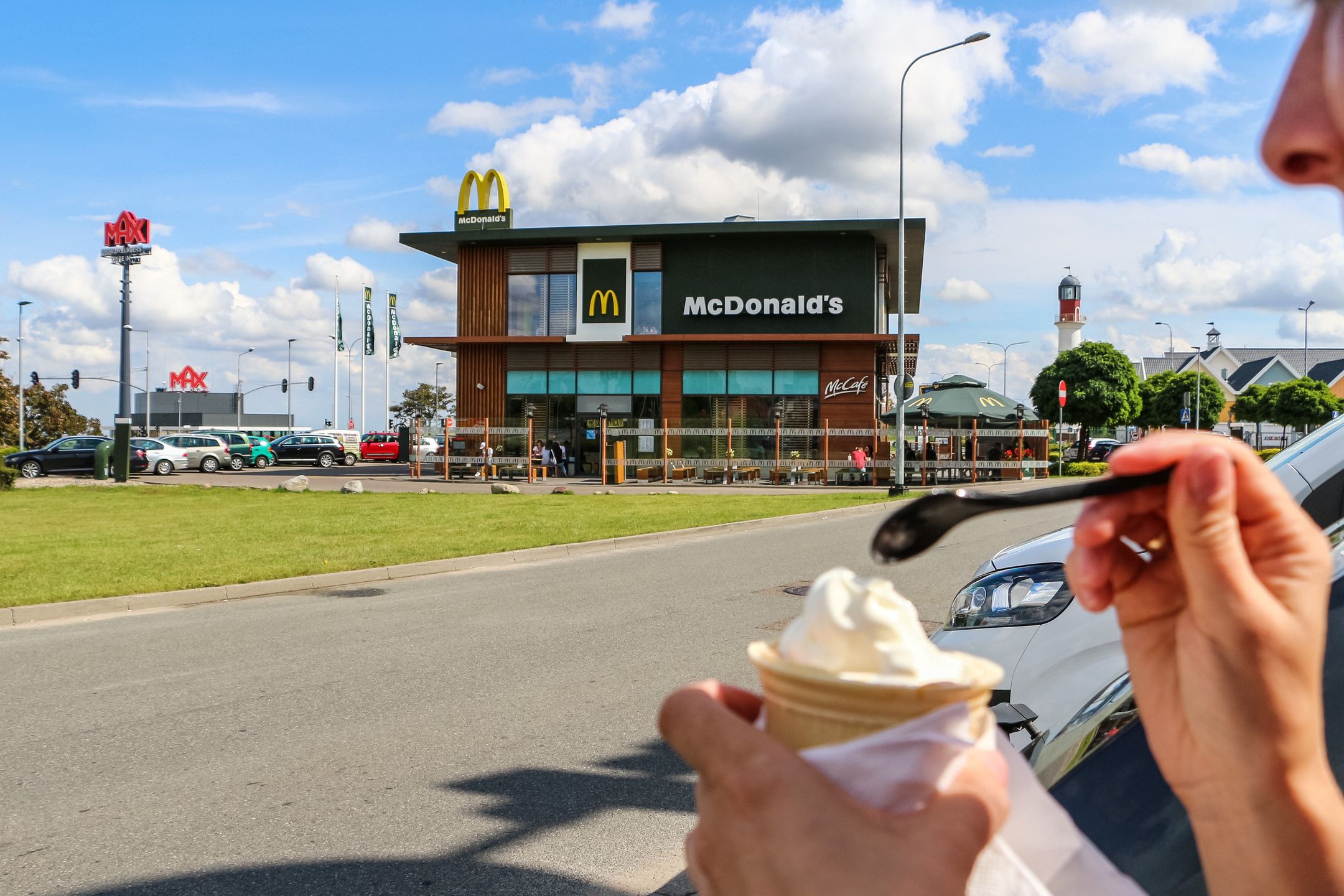 Girl eating an ice-cream outside the McDonalds McDrive restaurant is seen in Gdansk, Poland on 21 July 2019 Swedish fast food restaurant chain Max Hamburgerrestauranger AB (Max Hamburger Restaurants Incorporated tries to compete with most popular in Poland McDonald's fast food chain. The first Max Premium Burgers restaurant opened in Poland in 2017 in Wroclaw, and total number for today is 4 restaurants in Gdansk, Warszawa and Swietochlowice. (Photo by Michal Fludra/NurPhoto via Getty Images)