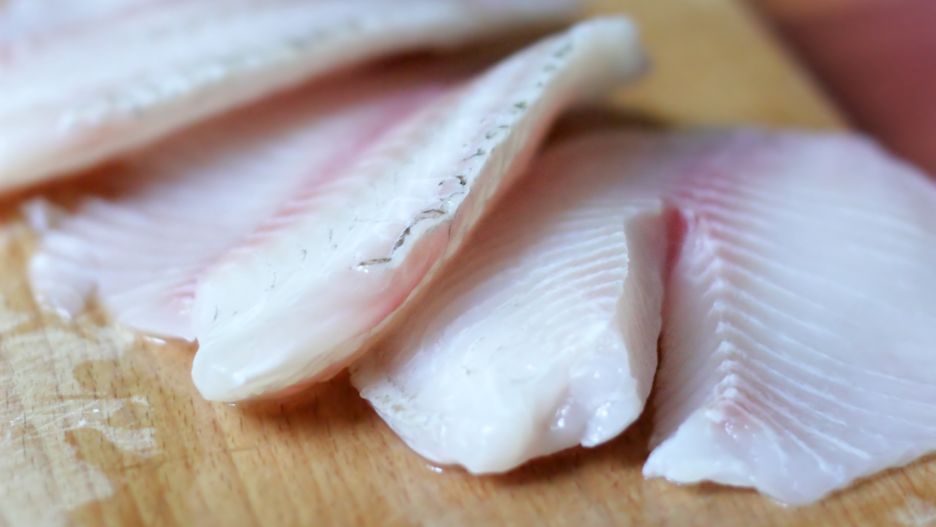 food, fish, tilapia, raw, fillet, slices, cutting board, cooking, table, organic, wooden, preparation, making, preparing, macro, close up