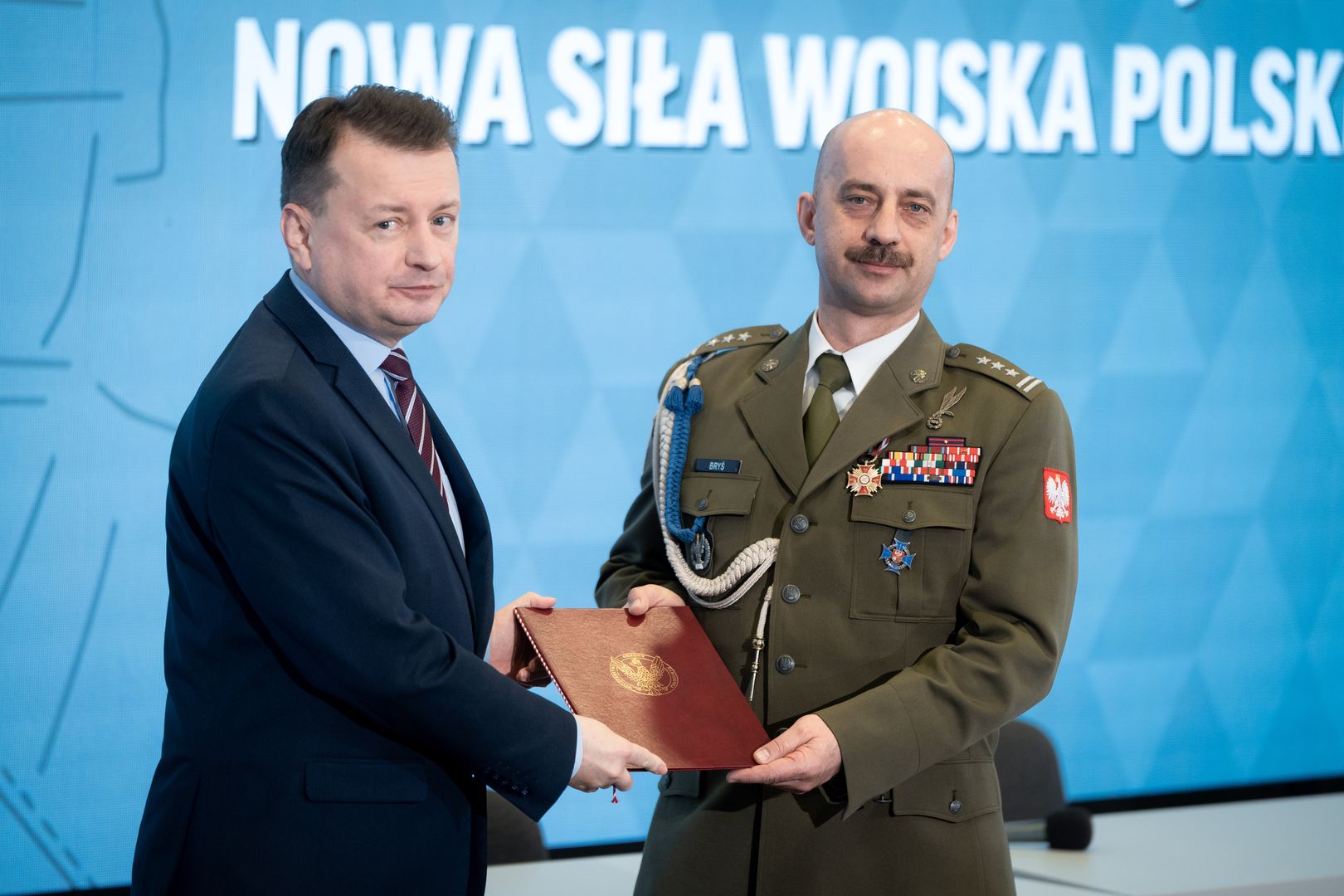Polish National Defence Minister Mariusz Blaszczak and Colonel Miroslaw Brys during the conference &quot;Homeland Defence Act - New Power of the Polish Army&quot; at War Studies Academy in Warsaw, Poland on March 28, 2022 (Photo by Mateusz Wlodarczyk/NurPhoto via Getty Images)