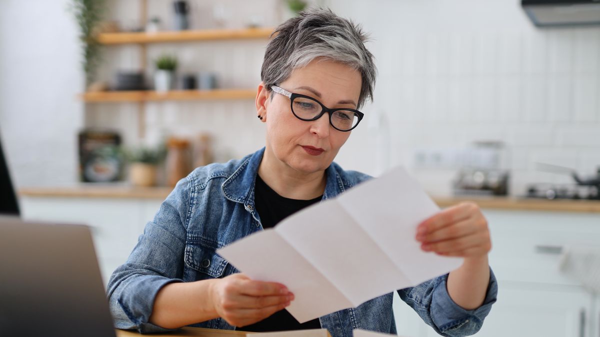 Serious mature woman in glasses reading the bill in the kitchen.
document, reading, home, woman, budget, laptop, paperwork, bill, female, businesswoman, finance, financial, letter, invoice, business, computer, elderly, income, insurance, loan, money, online, retirement, senior, tax, working, bank, looking, office, kitchen, house, accountant, accounting, banking, desk, entrepreneur, grandmother, information, mature, pay, payment, pension, plan, professional, retired, saving, serious, sitting, person