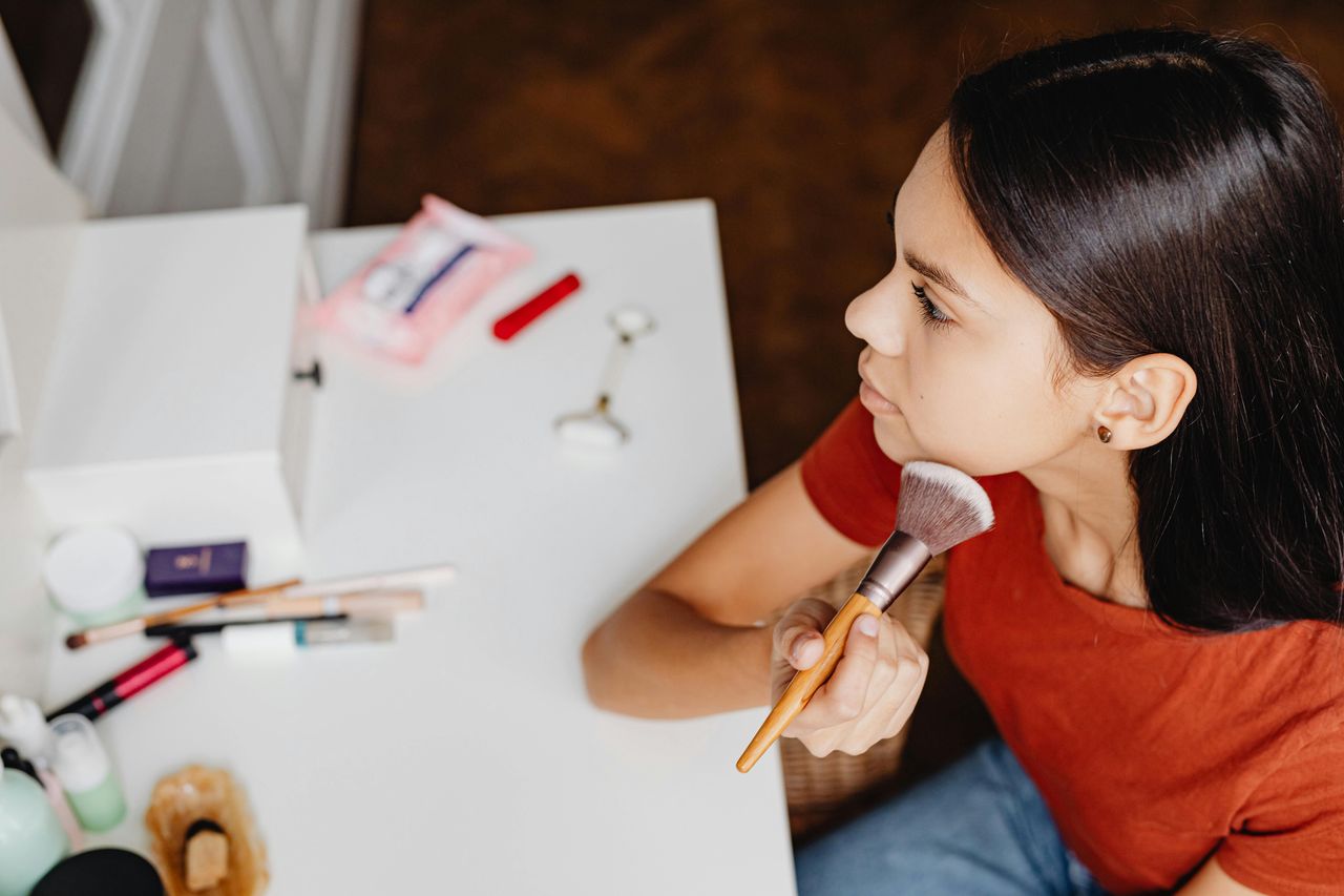 A girl doing "Passport makeup".