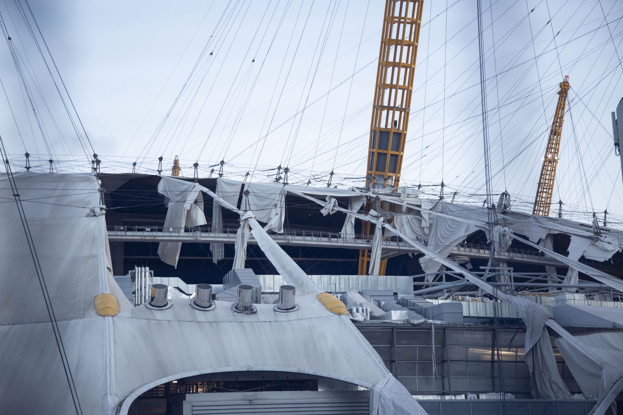 LONDON, ENGLAND - FEBRUARY 18: A view from The O2 Arena after its roof was damaged as the Storm Eunice brings high winds across the country in London, United Kingdom on February 18, 2022. Train services were suspended in London and Wales due to the storm. People struggle to walk, trees fell and so many damages occured in the wind. Storm Eunice negatively impacted daily life as authorities urged people to "stay at home" except in emergencies. (Photo by Rasid Necati Aslim/Anadolu Agency via Getty Images)