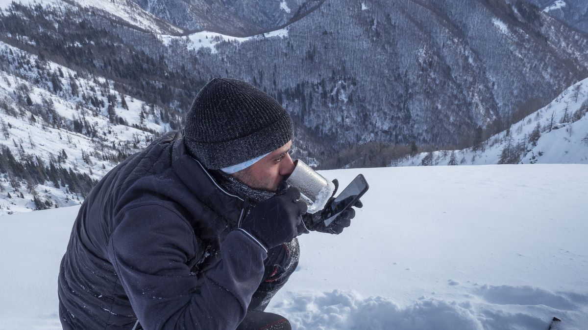 Climber checking his smartphone
A caucasian climber on a snowy mountaintop drinking tea and checking his smartphone
Buena Vista Images