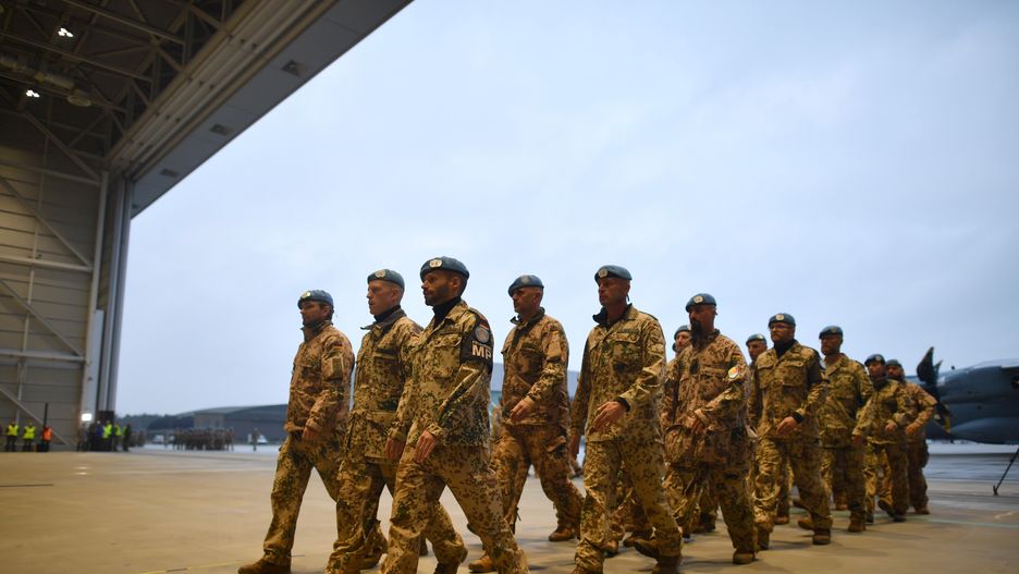 WUNSTORF, GERMANY - DECEMBER 15: Soldiers of the Bundeswehr (German Armed Forces) stand in line after leaving an A400m transport plane as they return from Mali on December 15, 2023 in Wunstorf, Germany. Germany is ending its 10-year participation in the multinational United Nations MINUSMA peacekeeping effort in Mali following the termination of the entire mission last summer at the request of the Mali government. (Photo by Alexander Koerner/Getty Images)
