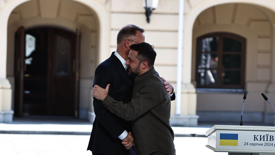 KYIV, UKRAINE - AUGUST 24: Volodymyr Zelenskyi (R), President of Ukraine, and Andrzej Duda (L), President of Poland, embrace during a joint briefing on the 33rd anniversary of the independence of Ukraine on August 24, 2024 in Kyiv, Ukraine. On August 24, Ukraine celebrates its 1991 declaration of independence from the USSR. For security reasons, no large mass events were held in Kyiv on this day, except some solemn activities. (Photo by Yan Dobronosov/Global Images Ukraine via Getty Images)
