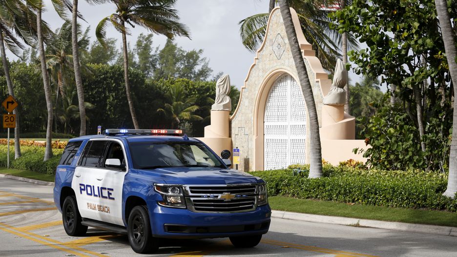 A Palm Beach Police officer at the entrance of former US President Donald Trump's house at Mar-A-Lago in Palm Beach, Florida, US, on Tuesday, Aug. 9, 2022. Donald Trump faces intensifying legal and political pressure after FBI agents searched his Florida home in a probe of whether he took classified documents from the White House when he left office, casting a shadow on his possible run for the presidency in 2024. Photographer: Eva Marie Uzcategui/Bloomberg via Getty Images