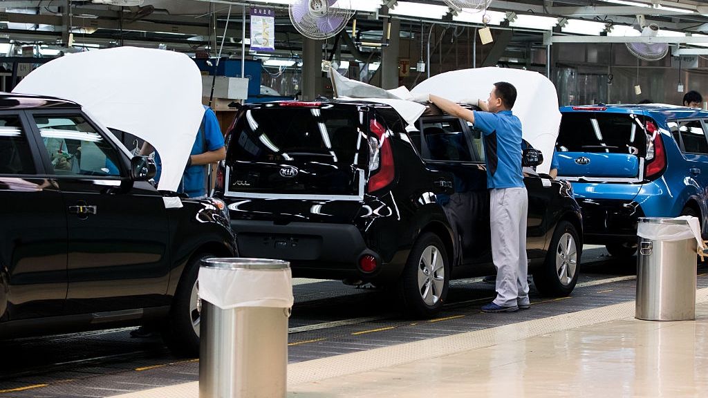 Inside A Kia Motors Corp. Factory And Delivery Center Ahead Of PPI Figures
An employee covers a Kia Motors Corp. Soul vehicle on the production line at the company's plant in Gwangju, South Korea, on Friday, July 8, 2016. South Korea is scheduled to release producer price index (PPI) figures on July 19. Photographer: SeongJoon Cho/Bloomberg via Getty Images
Bloomberg
East Asian, Automobiles, Manufacturing, Automotive, Cars, Manufacture