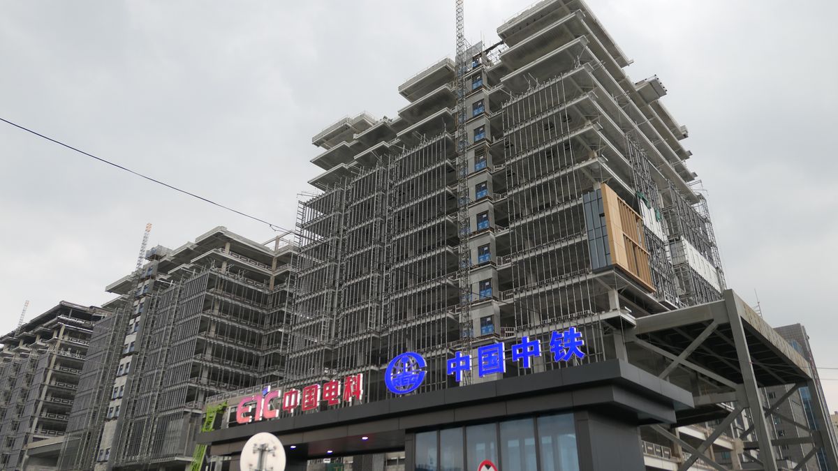 BEIJING, CHINA - AUGUST 18, 2021 - The China Railway and China Dianke Building under construction at Fucheng Road, Haidian District, Beijing, August 18, 2021. China Railway said on August 17 that it has completed five modern mines in China and abroad, including Luming Molybdenum Mine in Heilongjiang, Green Silk Copper and Cobalt mine in Congo (Gold), MKM Copper and Cobalt mine in Congo, SICOMINE Copper and cobalt mine in Huagang and Wulan Lead and zinc mine in Mongolia. (Photo credit should read Costfoto/Barcroft Media via Getty Images)