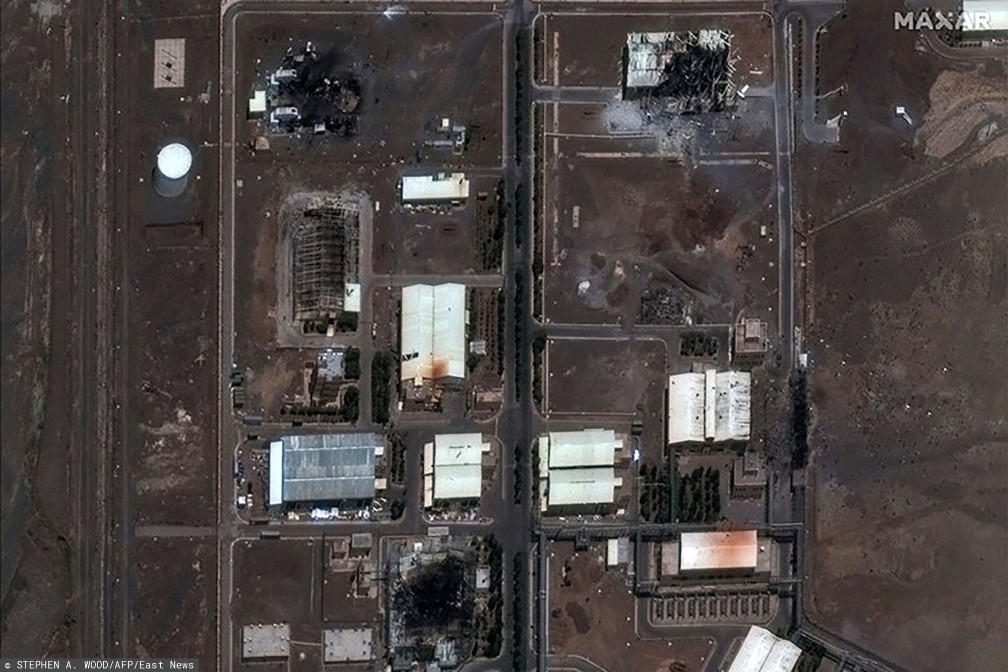 Temporary
This handout satellite image provided by Maxar Technologies and taken on June 14, 2025, shows the Natanz nuclear facilities (Shahid Ahmadi Roshan Nuclear Facilities) near Ahmadabad in Iran, after an Israeli strike. Israeli Prime Minister Benjamin Netanyahu threatened on June 14 to strike "every target of the ayatollah regime" in Iran, adding that Israeli strikes had dealt a "real blow" to Tehran's nuclear programme. (Photo by Stephen A. Wood / Satellite image �2021 Maxar Technologies / AFP) / RESTRICTED TO EDITORIAL USE - MANDATORY CREDIT "AFP PHOTO / Satellite image �2021 Maxar Technologies " - NO MARKETING - NO ADVERTISING CAMPAIGNS - DISTRIBUTED AS A SERVICE TO CLIENTS - The watermark may not be removed/cropped / THE WATERMARK MAY NOT BE REMOVED/CROPPED
STEPHEN A. WOOD