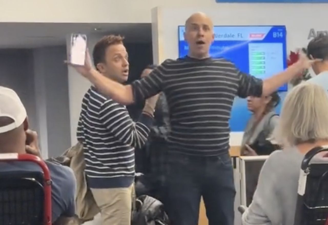 Men were arguing at the airport.