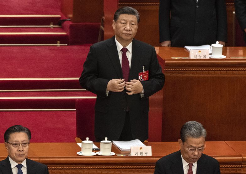 BEIJING, CHINA - MARCH 5: Chinese President Xi Jinping stands during the opening of the NPC, or National People's Congress, at the Great Hall of the People on March 5, 2024 in Beijing, China. China's annual political gathering known as the Two Sessions will convene leaders and lawmakers to set the government's agenda for domestic economic and social development for the year. (Photo by Kevin Frayer/Getty Images)