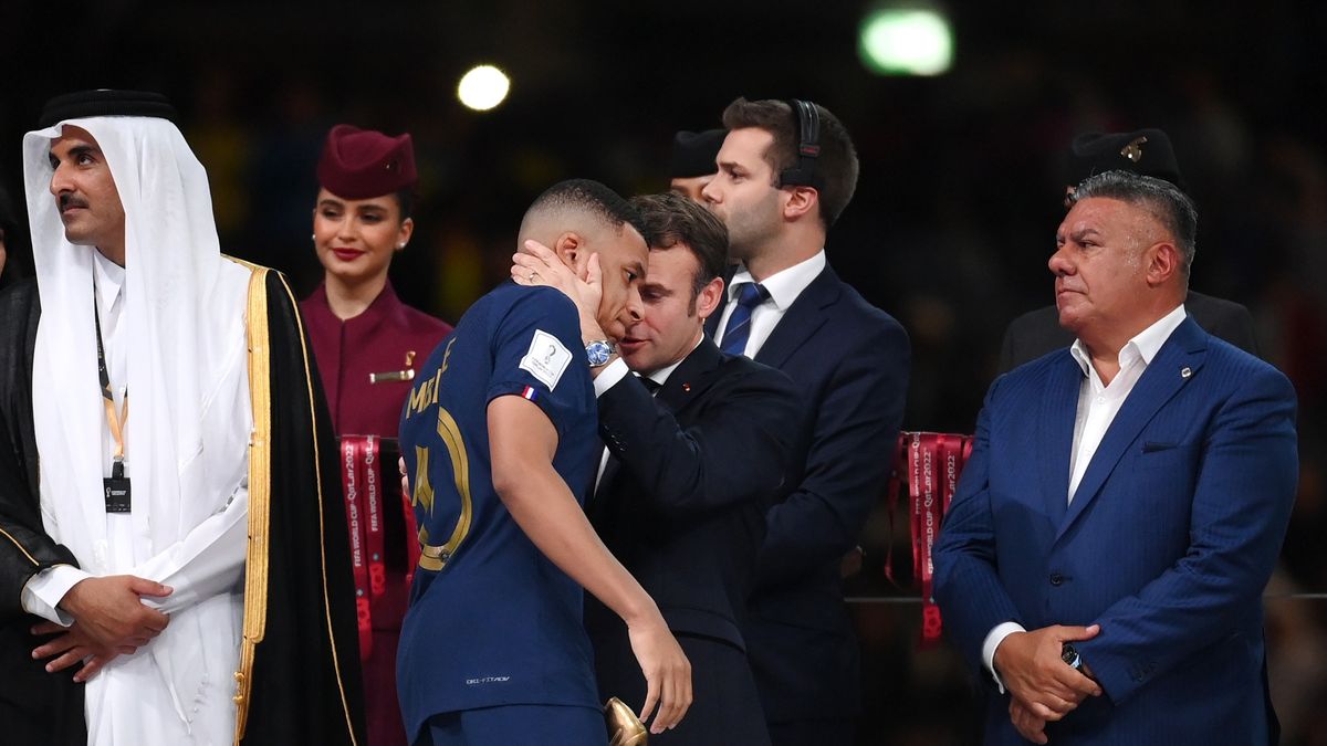 LUSAIL CITY, QATAR - DECEMBER 18: Kylian Mbappe of France interacts with Emmanuel Macron, President of France following the FIFA World Cup Qatar 2022 Final match between Argentina and France at Lusail Stadium on December 18, 2022 in Lusail City, Qatar. (Photo by Shaun Botterill - FIFA/FIFA via Getty Images)