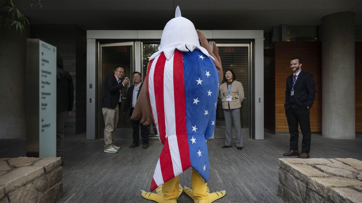 BEIJING, CHINA - NOVEMBER 6: A staffer dressed as a U.S. bald eagle waits to greet guests at an election watch party at the U.S. embassy on November 6, 2024 in Beijing, China. People tuned in to watch the pivotal 2024 U.S. presidential election at venues and in homes across Asia, with the result having direct consequences for trade, security and geopolitics in the region. (Photo by Kevin Frayer/Getty Images)