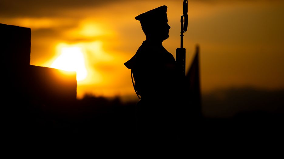 GDANSK, POLAND - 2023/09/01: Silhouette of a soldier with a gun during the 84th anniversary of the outbreak of World War II in Westerplatte. On the 84th anniversary of the outbreak of World War II, people in Poland gathered in Westerplatte to remember and pay tribute to those who were killed and abused during one of the most terrible tragedies in world history. The Polish government organized the anniversary event to remind the people never to let World War happen again. (Photo by Mateusz Slodkowski/SOPA Images/LightRocket via Getty Images)