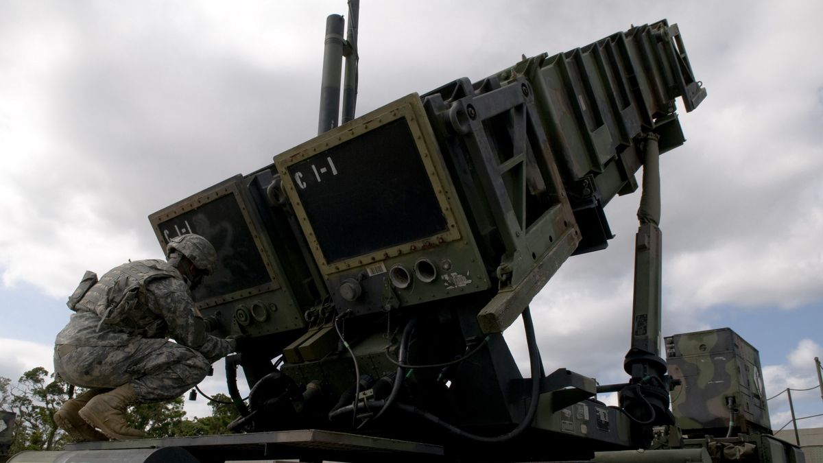 U.S. Army Patriot Missile operator simulates unlocking the launcher caps during a field training exercise on Kadena Air Base, Japan.
Stocktrek Images
kadena air base, soldier, us army, horizontal, military, day, outdoors, photography, color image, patriot missile system, mim-104 patriot, artillery, surface-to-air, missile launchers, missile systems, weapon systems, launcher, defense, army, us armed forces, angle, rear view, crouching, full length, adult, one person, hydraulics, checking, tactical, transport, logistics vehicle system, vehicle, preparation, air defense systems, maintenance, setting up, m901, palletized load system, japan