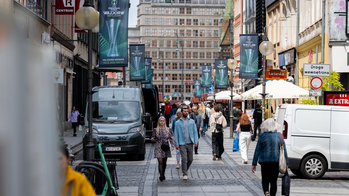 WROCLAW, POLAND - MAY 26: People seen passing the streets of Wroclaw ahead of the UEFA Conference League Final 2025 between Real Betis Balompié and Chelsea FC at Wroclaw Stadium on May 26, 2025 in Wroclaw, Poland. (Photo by Mateusz Slodkowski - UEFA/UEFA via Getty Images)