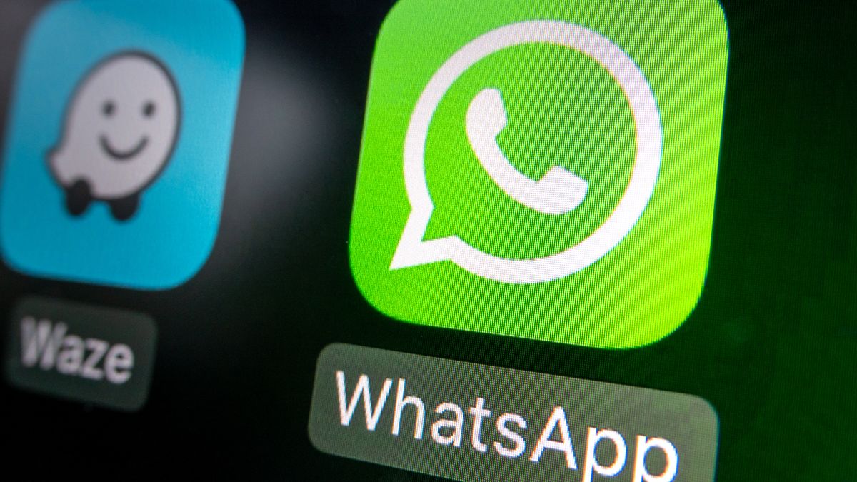 BATH, UNITED KINGDOM - JANUARY 15: In this photo illustration a car's Apple CarPlay screen displays the logo of Meta's instant messaging service WhatsApp, on January 15, 2025 in Bath, England. (Photo by Anna Barclay/Getty Images)