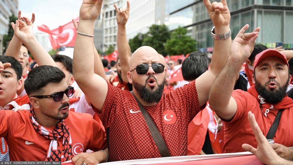 Temporary
Supporters of Turkey make a controversial hand gesture as they gather at Breitscheidplatz square in the center of Berlin before the quarter final UEFA Euro 2024 football match Netherlands v Turkey, held later at Berlin's Olympic stadium on June 6, 2024. UEFA said on July 3, 2024 it had opened a probe into Turkey defender Merih Demiral for celebrating a goal in the team's 2-1 win against Austria at Euro 2024 with an allegedly ultra-nationalist salute. (Photo by RALF HIRSCHBERGER / AFP)
RALF HIRSCHBERGER