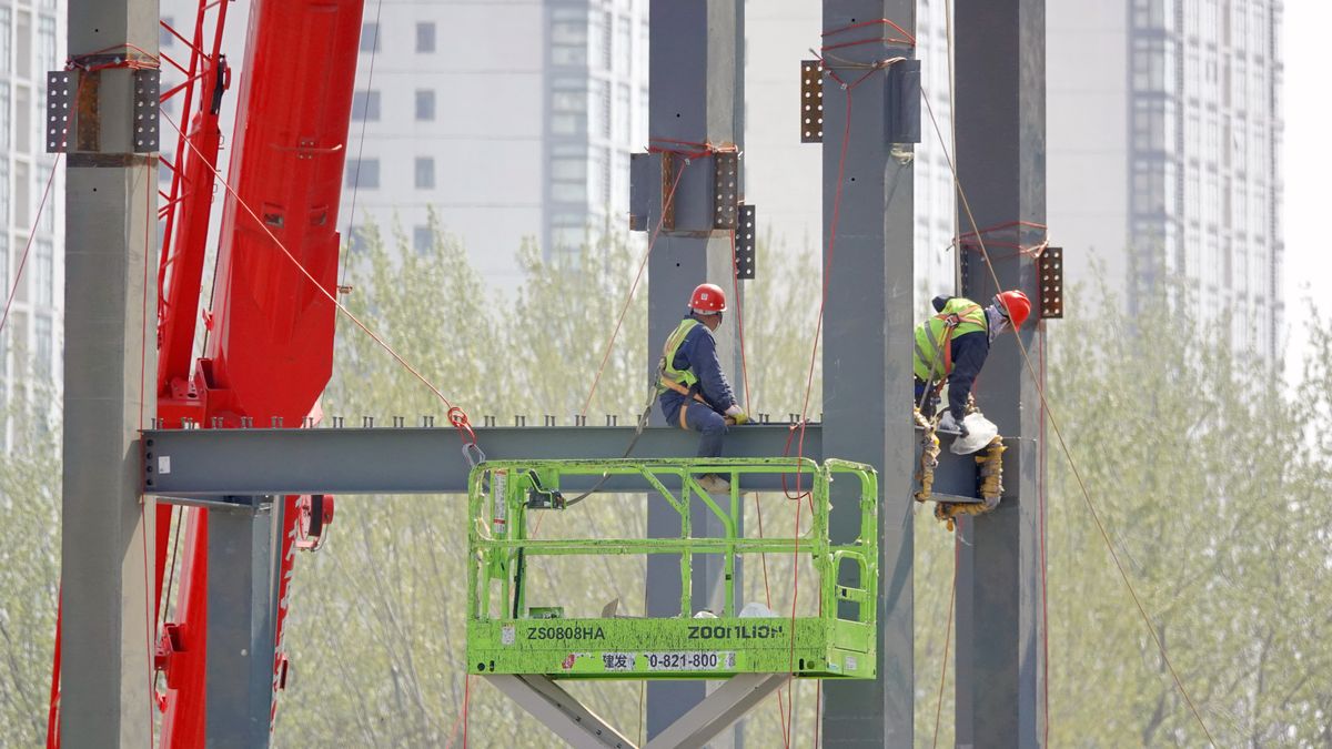 A real estate project is under construction in Yantai, Shandong Province, China, on April 14, 2024. The Middle Finger Research Institute has released data showing that from January to March 2024, the total sales of the top 100 housing enterprises amounted to 897.83 billion yuan. Among these, 21 housing enterprises have total sales exceeding 10 billion yuan, and the monthly sales of the top 100 housing enterprises have increased by 117.3% in March. (Photo by Costfoto/NurPhoto via Getty Images)