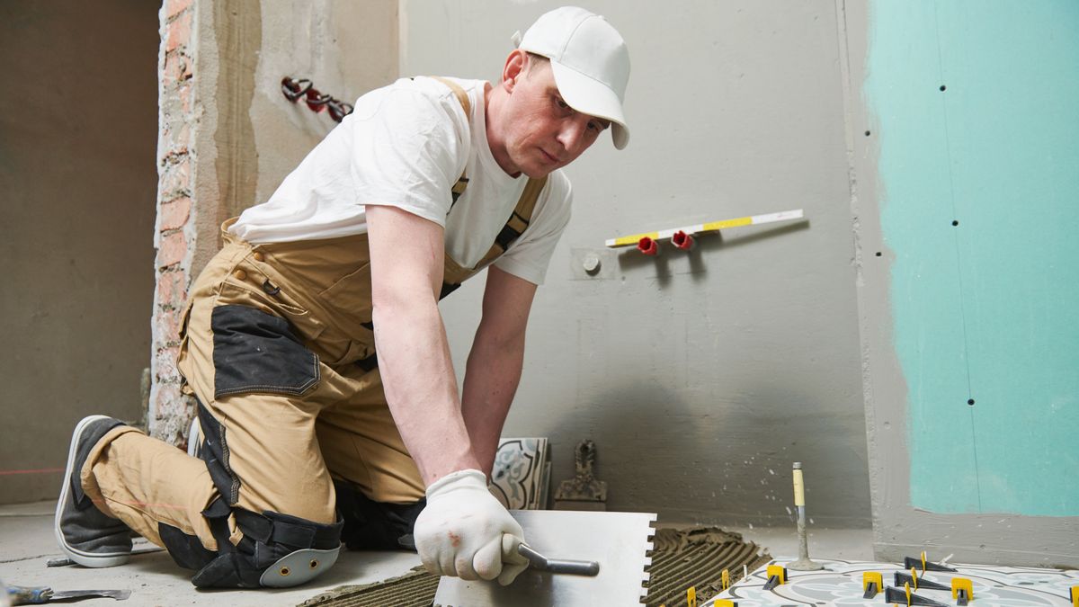 Tiler installing tile on bathroom floor. home indoors renovationTiler installing decoration ceramic tile on floor in bathroom. home indoors renovationtiler, tiling, ceramic, metro, tile, laying, installing, installer, bathroom, flooring, floor, decoration, decor, craftsman, workman, hands, worker, man, work, working, construction, building, builder, contractor, mason, renewal, improvement, renovation, glue, gluing, tiler, tiling, ceramic, metro, tile, laying, installing, installer, bathroom, flooring, floor, decoration, decor, craftsman, workman, hands, worker, man, work, working, construction, building, builder, contractor, mason, renewal, improvement, renovation, glue, gluing