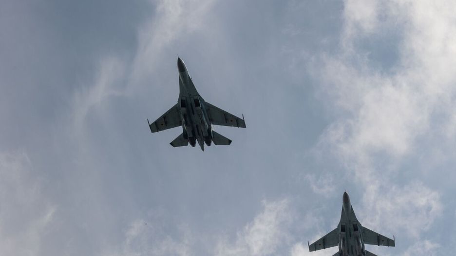 UKRAINE - AUGUST 4: (----EDITORIAL USE ONLY - MANDATORY CREDIT - UKRAINIAN PRESIDENCY / HANDOUT' - NO MARKETING NO ADVERTISING CAMPAIGNS - DISTRIBUTED AS A SERVICE TO CLIENTS----) F-16 Fighting Falcons perform in the sky as President of Ukraine Volodymyr Zelensky delivers a speech congratulating the Ukrainian military on the stand in front of the first General Dynamics F-16 Fighting Falcon received by Ukraine on August 4, 2024 in, Ukraine. The first General Dynamics F-16 Fighting Falcons received by Ukraine were demonstrated at the Ukrainian Air Force Day event attended by President of Ukraine Volodymyr Zelensky. (Photo by Ukrainian Presidency/Handout/Anadolu via Getty Images)