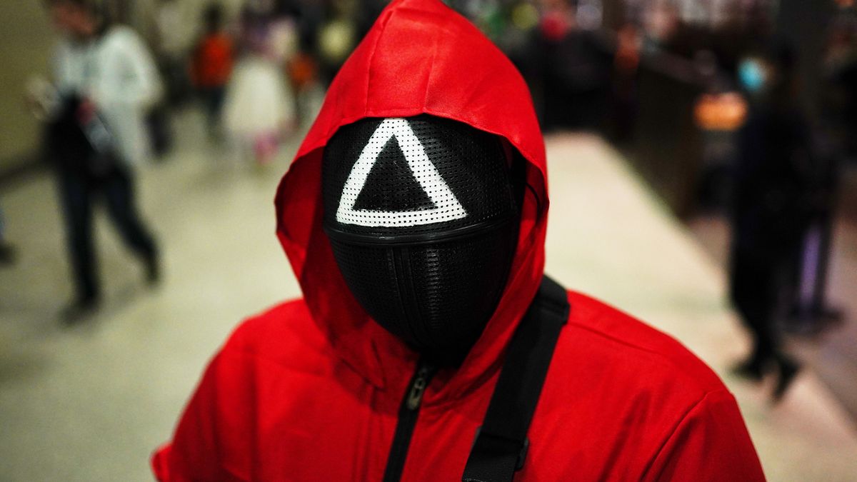 Joshua Bizzell from Greater London dressed as a character from the Netflix series Squid Game during the second day of MCM Comic Con at the ExCel London in east London. Picture date: Saturday October 23, 2021. (Photo by Aaron Chown/PA Images via Getty Images)