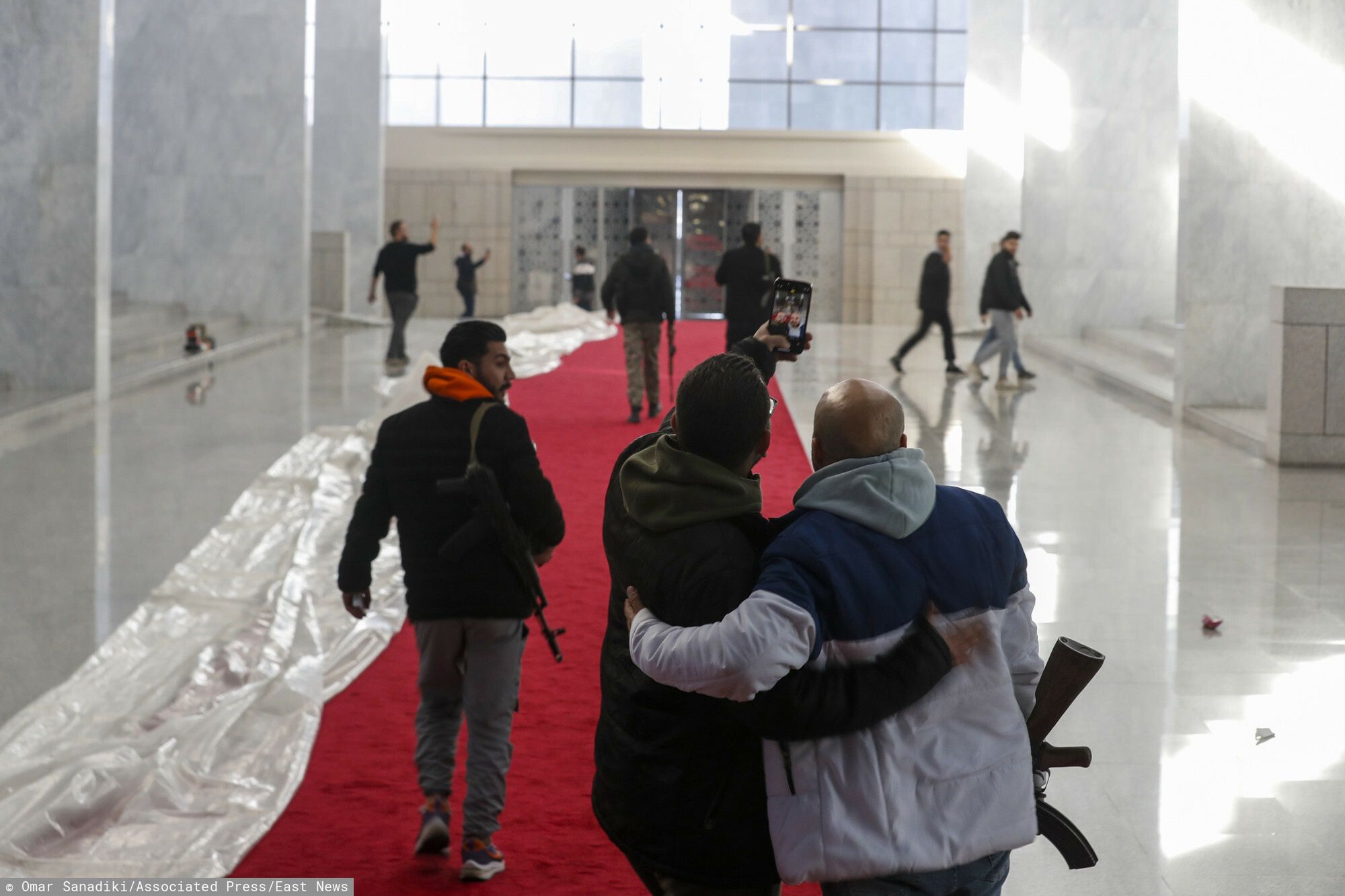 Temporary
Syrian opposition fighters take a selfie inside the Presidential Palace after the Syrian government collapsed in Damascus, Syria, Sunday, Dec. 8, 2024. (AP Photo/Omar Sanadiki)
Omar Sanadiki