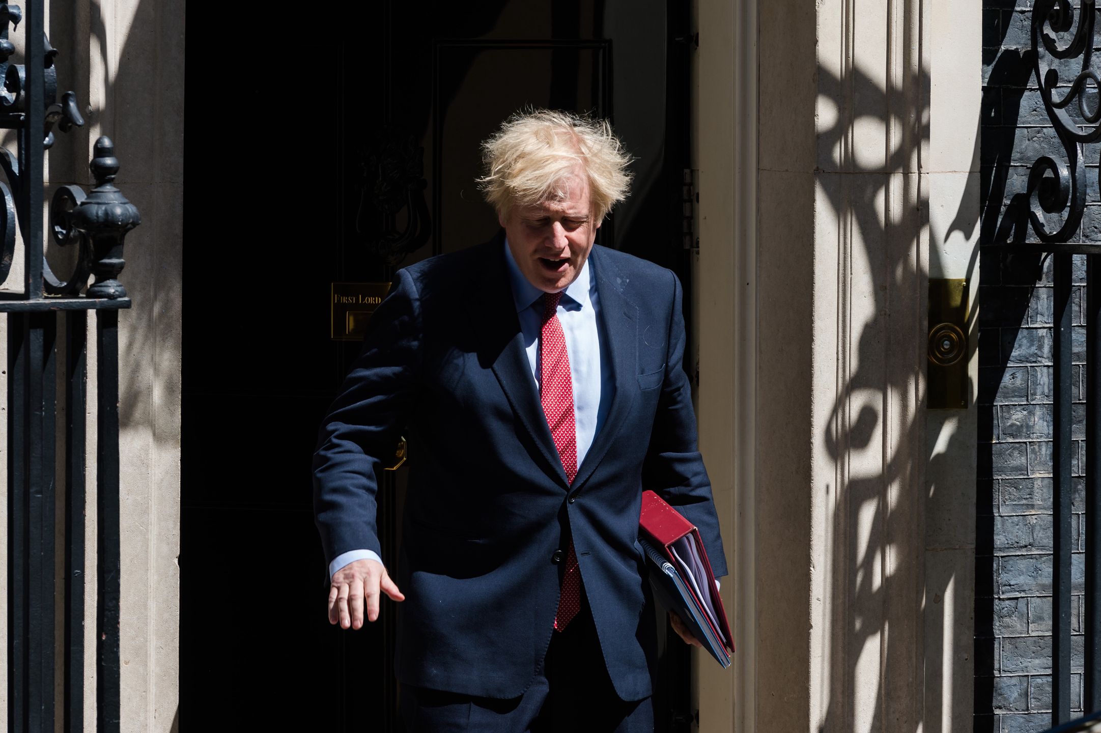 British Prime Minister Boris Johnson leaves 10 Downing Street for PMQs at the House of Commons on 20 May, 2020 in London, England. The UK remains in lockdown due to the coronavirus (Covid-19) pandemic with some of the restrictions eased across England last week as the number of fatalities and infection rates decline. (Photo by WIktor Szymanowicz/NurPhoto via Getty Images)