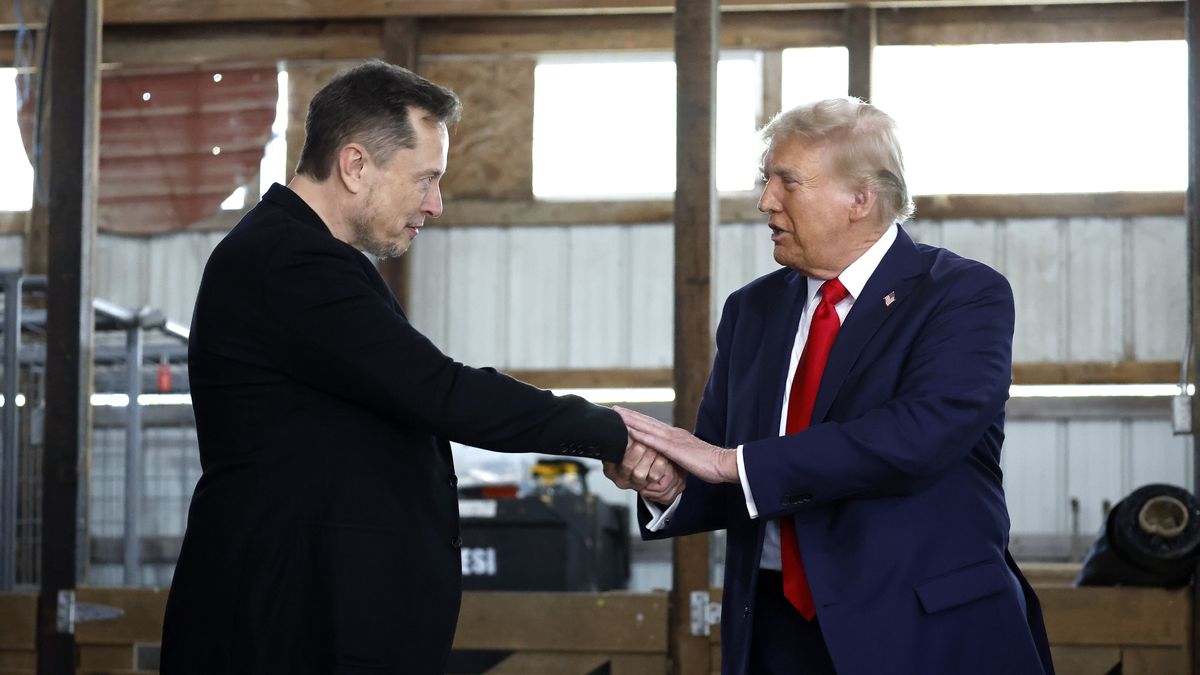 Republican Presidential Nominee Former President Trump Holds Rally In Butler, Pennsylvania
BUTLER, PENNSYLVANIA - OCTOBER 05: Elon Musk (L) shakes hands with Republican presidential nominee, former President Donald Trump back stage during a campaign rally at the Butler Farm Show grounds on October 05, 2024 in Butler, Pennsylvania. This is the first time that Trump has returned to Butler since he was injured during an attempted assassination on July 13.  (Photo by Anna Moneymaker/Getty Images)
Anna Moneymaker