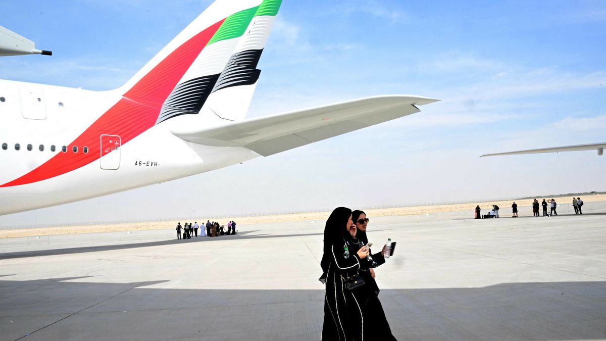 Dubai Airshow 2025Visitors walk near an Emirates Airbus A380 at Al-Maktoum International Airport during the Dubai Airshow 2025 in Dubai on November 17, 2025. (Photo by Giuseppe CACACE / AFP)GIUSEPPE CACACE