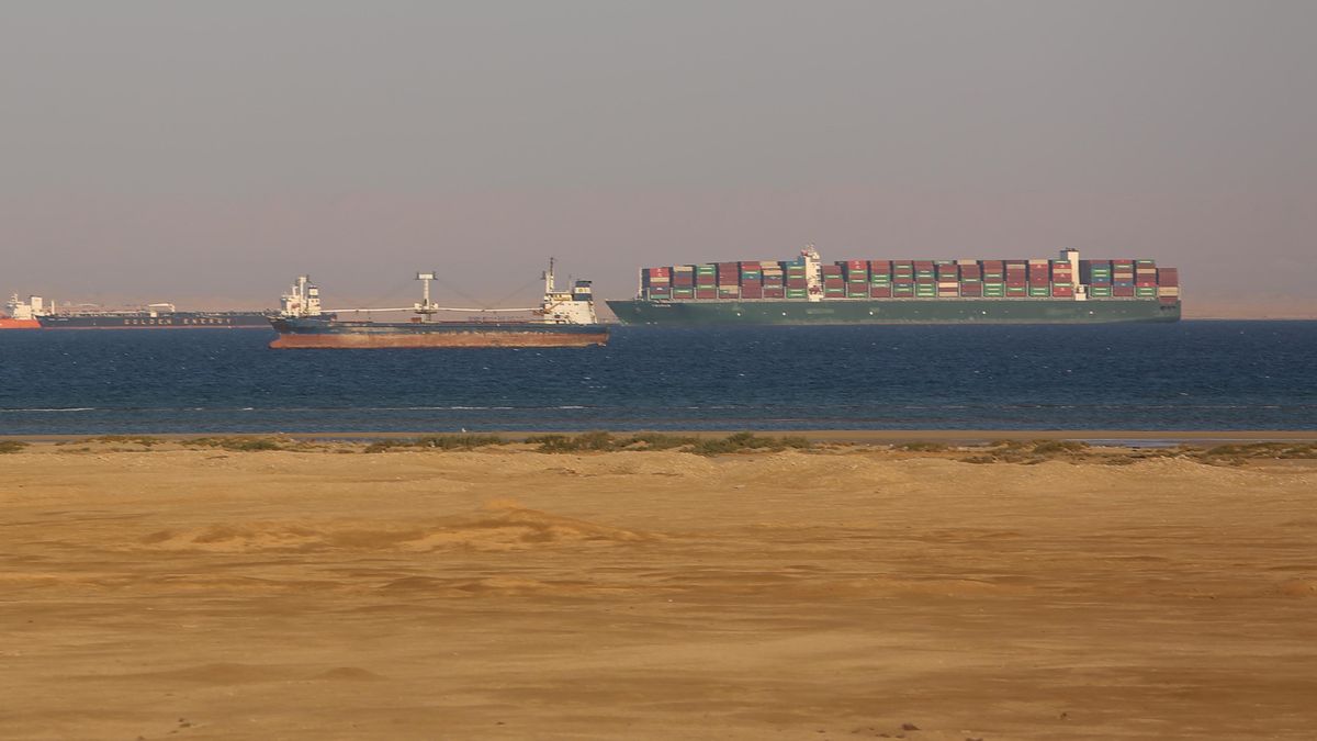 Commercial cargo and container ships ride anchor while waiting to enter the Suez Canal in Suez, Egypt, on Sunday, March 28, 2021. A new attempt could be made Sunday to re-float the 400-meter-long container ship 'Ever Given' blocking the Suez Canal. Photographer: Islam Safwat/Bloomberg via Getty Images