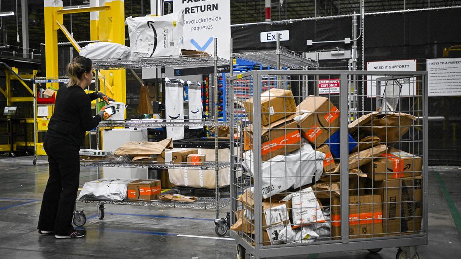 ORLANDO, FLORIDA  DECEMBER 2: An Amazon employee works to fulfill same-day orders during Cyber Monday, one of the company's busiest days at an Amazon fulfillment center on December 2, 2024 in Orlando, Florida. The fulfillment center, one of Amazon's largest for same-day deliveries, saw more than 200 workers sorting, packing, and shipping items throughout Central Florida. This location processes more than 20,000 packages on any given day, but during the holiday season, that number jumps to more than 80,000. (Photo by Miguel J. Rodriguez Carrillo/Getty Images)