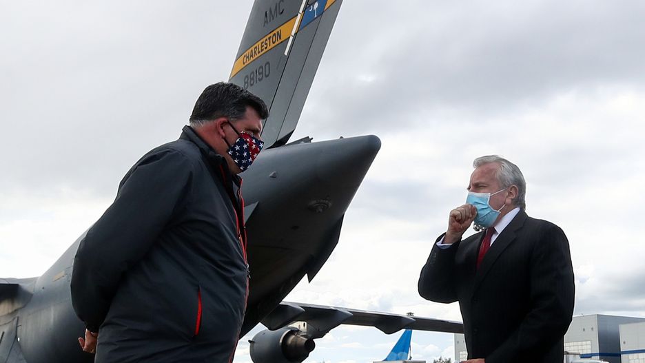 MOSCOW, RUSSIA - MAY 21, 2020: Brock Bierman (L), Assistant Administrator at the United States Agency for International Development (USAID), and US Ambassador to Russia John J. Sullivan by a McDonnell Douglas/Boeing C-17 Globemaster III military transport aircraft of the United States Air Force at Vnukovo-3 Airport. The plane has delivered medical ventilators for the Pirogov National Medical and Surgical Center. The USA plans to donate 200 ventilators to Russia amid the COVID-19 coronavirus pandemic. Valery Sharifulin/TASS (Photo by Valery Sharifulin\TASS via Getty Images)