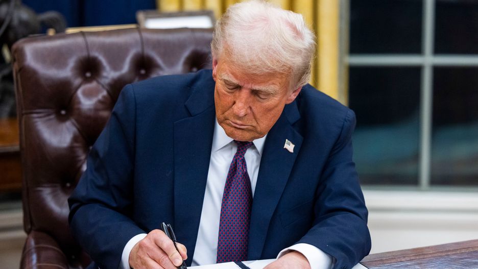 US President Donald Trump signs executive orders in the Oval Office of the White House in Washington, DC, US, on Monday, Jan. 20, 2025. President Donald Trump launched his second term with a strident inaugural address that vowed to prioritize Americas interests with a "golden age" for the country, while taking on "a radical and corrupt establishment." Photographer: Jim Lo Scalzo/EPA/Bloomberg via Getty Images