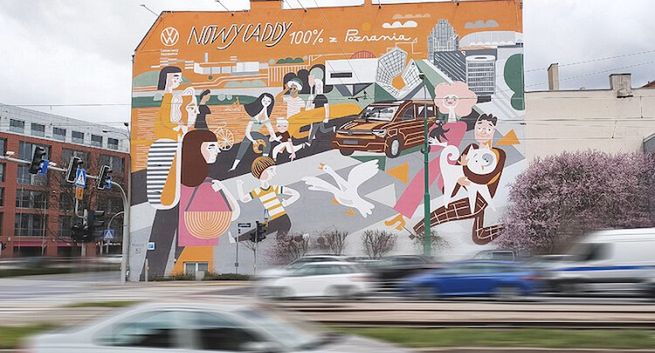 Dostawczy VW Caddy reklamowany muralem w Poznaniu