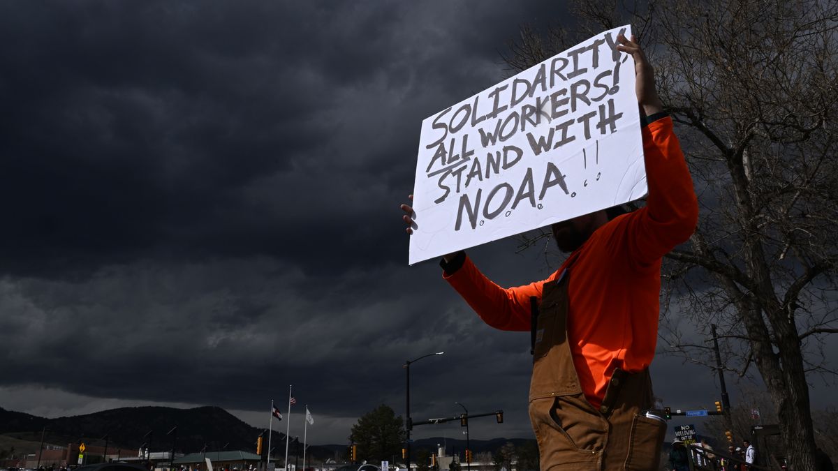 BOULDER , CO - MARCH  3: A man who did not want to be identified holds up a sign while standing along Broadway as he joins hundreds of others during a large rally and protest outside of NOAA in Boulder, Colorado on March 3, 2025.  Hundreds of protesters on Monday outside of NOAA offices at 325 Broadway in Boulder to protest firings of federal government employees. The rally was organized by David Skaggs, former US representative. The protesters were at the intersection of Broadway Street and Rayleigh Road, near the National Oceanic and Atmospheric Association in Boulder and lined Broadway in front of the building. Remarks were made by Ernest Hildner, solar physicist and former director of NOAA's Space Environment Center from 1986 until his retirement in 2005  and former US Senator Tim Wirth. (Photo by Helen H. Richardson/MediaNews Group/The Denver Post via Getty Images)