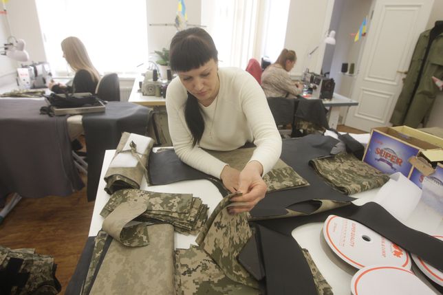 ODESSA, UKRAINE - MARCH 31: Workers of fashion design studio of Uzun Vitaliy which was designing women clothes before the Russian attacks, currently make bulletproof vests for Ukrainian army in Odessa, Ukraine, on March 31, 2022. (Photo by Vladimir Shtanko/Anadolu Agency via Getty Images)
