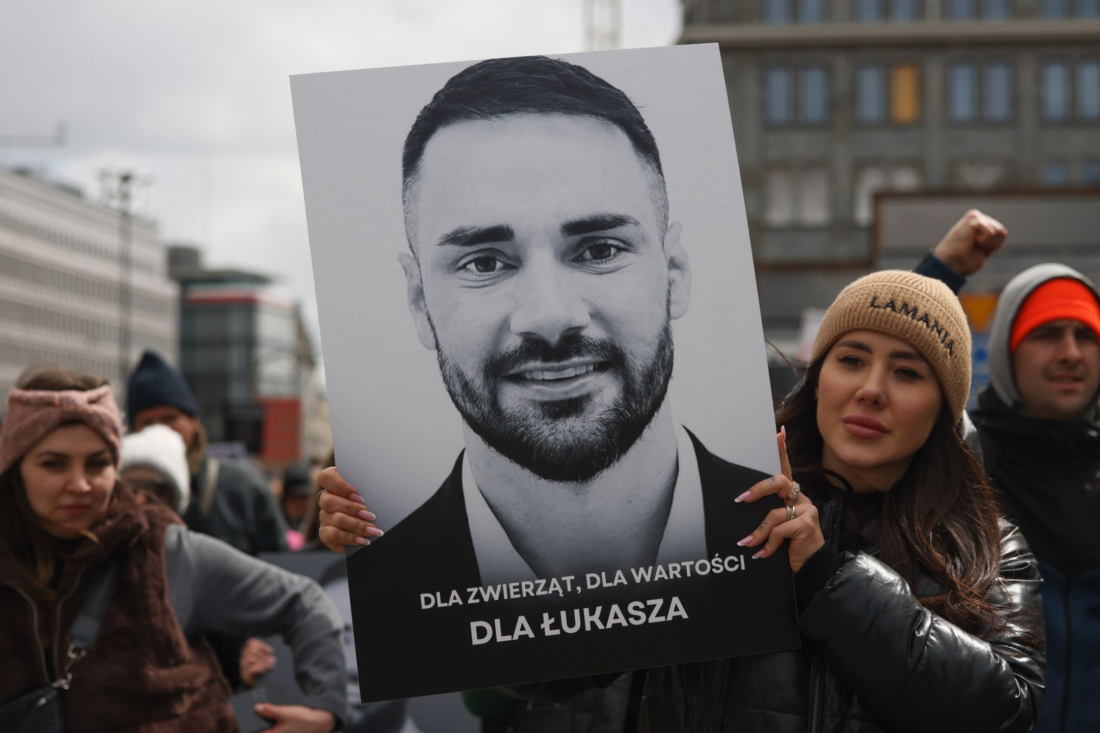People hold banners while attending an animal rights march 'Break the chains' in memory of MP Lukasz Litewka, who died in a tragic road accident three days earlier. Warsaw, Poland on April 26th, 2026. Participants gathered to honor Litewka's legacy as a staunch animal rights advocate. Protesters called for the passage of 'Lex Litewka', a proposed set of laws including a ban on tethering dogs with chains and stricter standards for animal welfare. Lukasz Litewka, 36, died on April 23rd after being struck by a car while riding a bicycle.   (Photo by Beata Zawrzel/NurPhoto via Getty Images)