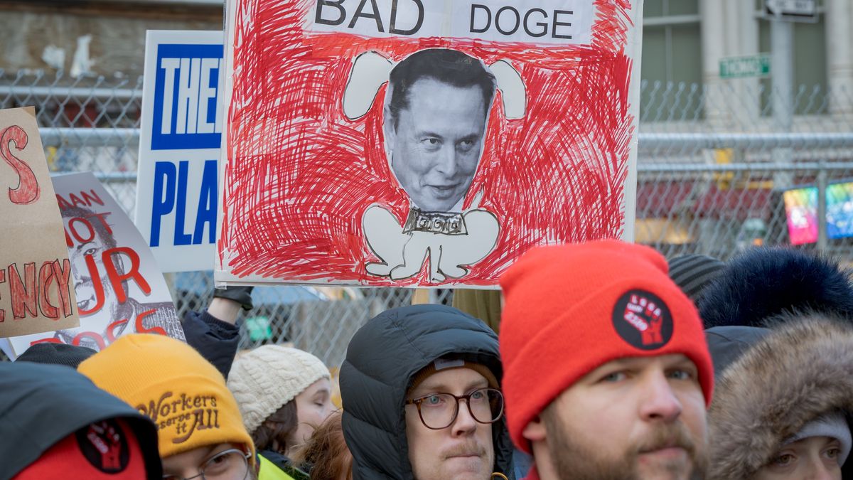 MANHATTAN, NEW YORK, UNITED STATES - 2025/02/19: Participant seen holding a sign at the protest. Federal Workers and everyday Americans gathered outside 26 Federal Plaza in Manhattan, the headquarters of the U.S. Citizenship and Immigration Services (USCIS) and the U.S. Immigration and Customs Enforcement's (ICE) for a protest against the Trump administration and the Department Of Government Efficiency (DOGE) to say NO to Elon Musk's push to gut federal services by freezing funding and impose mass layoffs. (Photo by Erik McGregor/LightRocket via Getty Images)