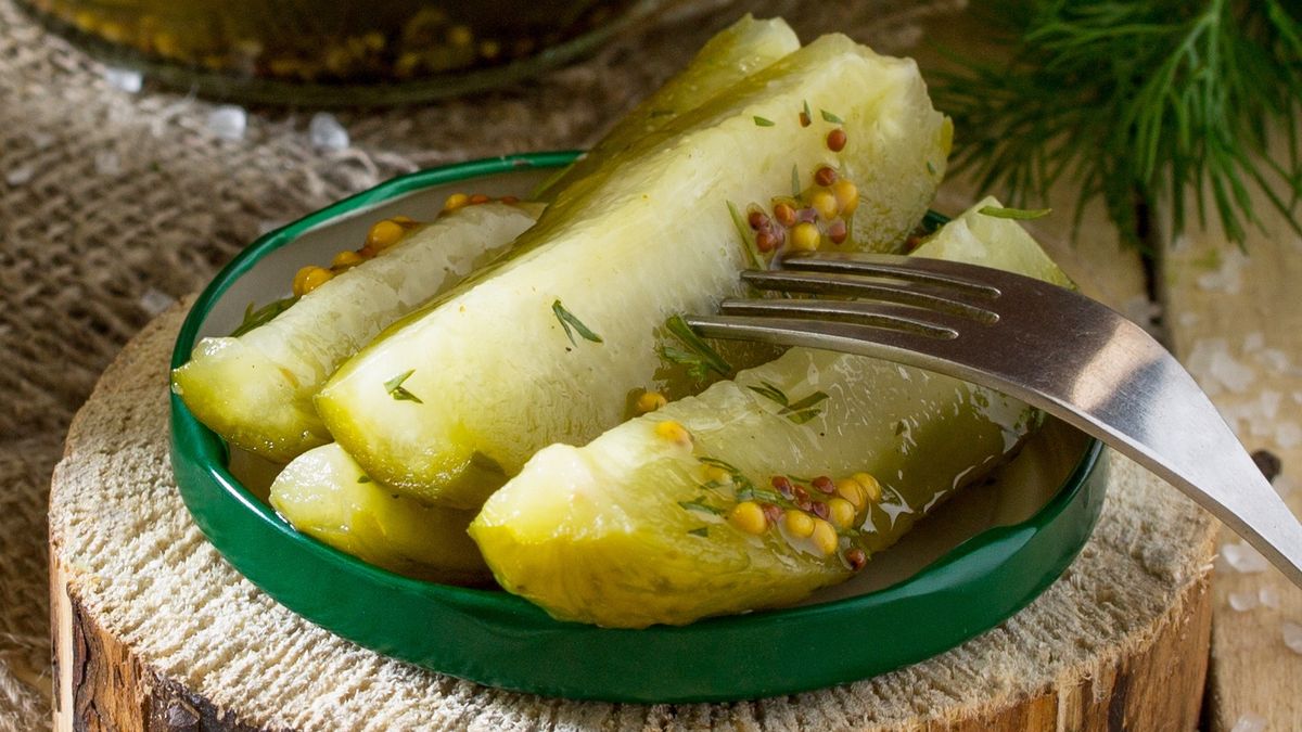 Marinated cucumbers gherkins. Marinated pickles with mustard and garlic on the kitchen table.cucumbers, marinated, pickles, gherkin, vinegar, mustard, garlic, heap, isolated, wet, vegetarian, slice, nobody, green, white, diet, snack, organic, canned, dill, gourmet, vegetable, season, dinner, small, tasty, fermented, healthy, production, crisp, seasoning, ingredient, background, fresh, mustard, nutrition, sliced, food, eating, course, sour, of, cucumbers, marinated, pickles, gherkin, vinegar, mustard, garlic, heap, isolated, wet, vegetarian, slice, nobody, green, white, diet, snack, organic, canned, dill, gourmet, vegetable, season, dinner, small, tasty, fermented, healthy, production, crisp, seasoning, ingredient, background, fresh, nutrition, sliced, food, eating, course, sour, of