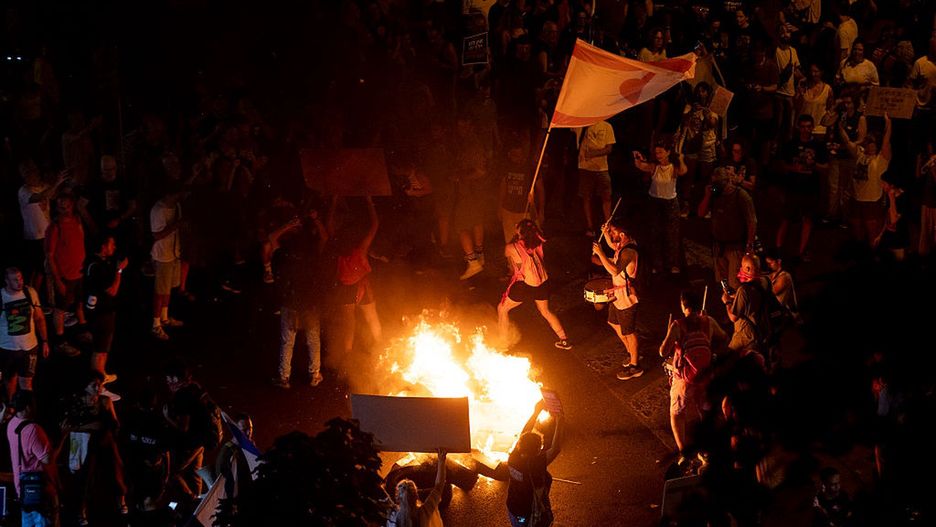 Demonstrators Protest Against Netanyahu's Plans To Expand Occupation In Gaza
TEL AVIV, ISRAEL - AUGUST 7: Protesters set a fire as they hold signs and flags during a protest calling for a hostages deal on August 7, 2025 in Tel Aviv, Israel. Local media reports that Israeli Prime Minister Benjamin Netanyahu is seeking backing from his security cabinet for the "full occupation" of the Gaza Strip, despite warnings from security officials and human rights groups that such a move could further endanger the lives of hostages still believed to be held alive by Hamas, as well as Palestinians already suffering displacement and an acute hunger crisis in Gaza. (Photo by Amir Levy/Getty Images)
Amir Levy