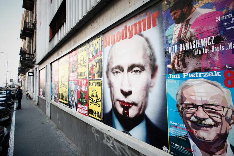 An anti-war poster with an image of Russian president Vladimir Putin is seen in central Warsaw, Poland on 23 March, 2022. (Photo by STR/NurPhoto via Getty Images)