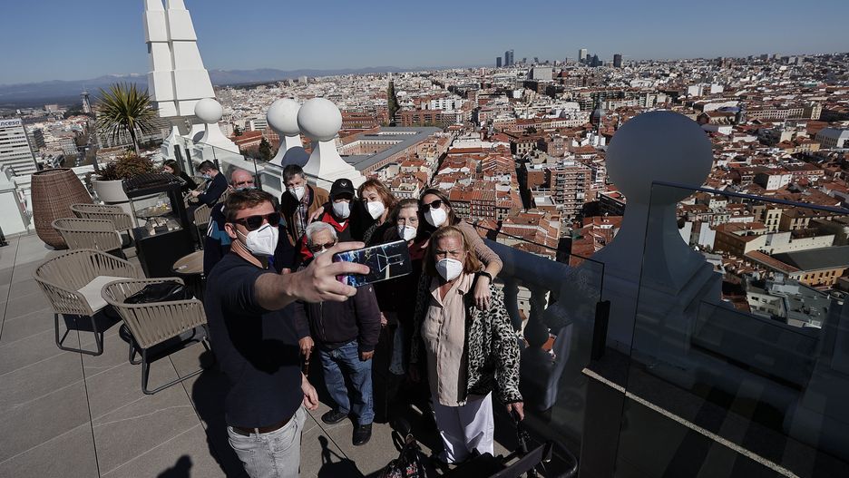 MADRID, SPAIN - MARCH 15: Elderly people who received Covid-19 vaccines enjoy the scenery of the city from the observation deck of a hotel in Madrid, Spain on March 15, 2021. Special event organized to give morale to the elderly people who are over 80 years who were most affected by the pandemic. (Photo by Burak Akbulut/Anadolu Agency via Getty Images)