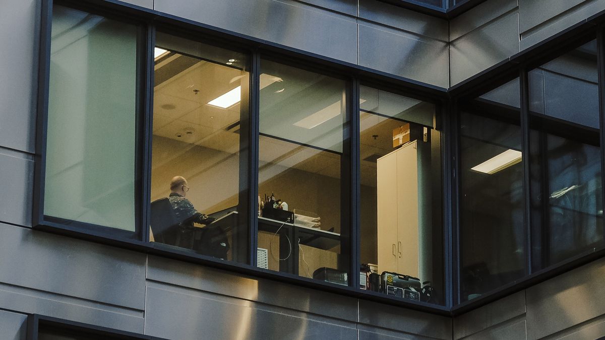 A worker in an office building in the Wola district of Warsaw, Poland, on Friday, Dec. 22, 2023. The central bank halted interest rate cuts after the Oct. 15 parliamentary election unexpectedly brought the pro-European Union opposition to power, along with their promises to boost budget spending. Photographer: Damian Lemaski/Bloomberg via Getty Images