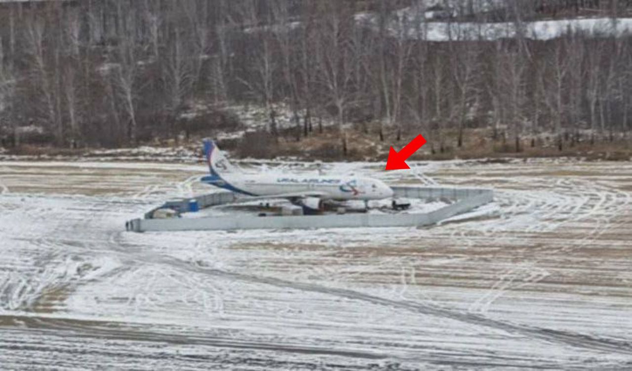 Emergency landing in a field leaves Russian plane stranded
