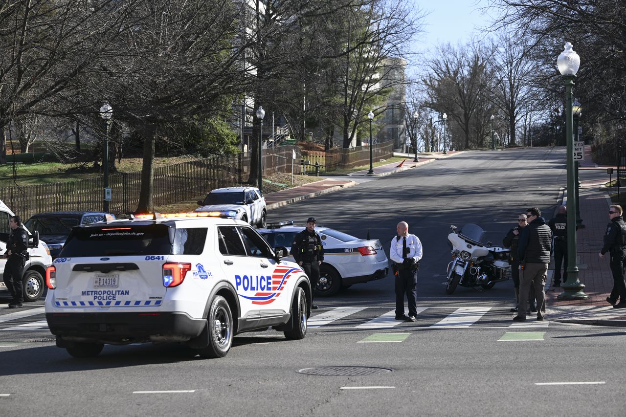 WASHINGTON D.C., UNITED STATES - FEBRUARY 25: Police take security measures and investigate the crime scene after a man set himself alight in front of the Israeli Embassy in Washington, United States on February 25, 2024. The man was subsequently referred to a regional hospital in critical condition due to serious injuries. (Photo by Celal Gunes/Anadolu via Getty Images)