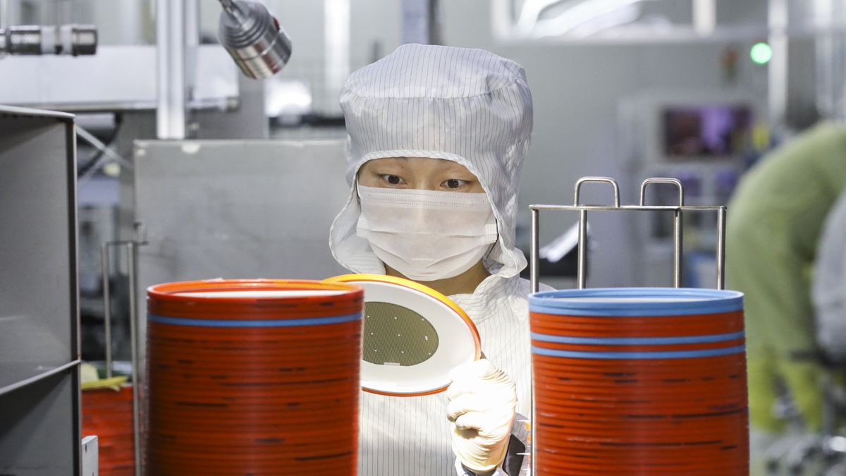 HUAI'AN, CHINA - APRIL 29, 2024 - A worker produces chips for mobile phones, cars, LED lighting at a workshop in Huai 'an city, Jiangsu province, China, April 29, 2024. (Photo credit should read CFOTO/Future Publishing via Getty Images)