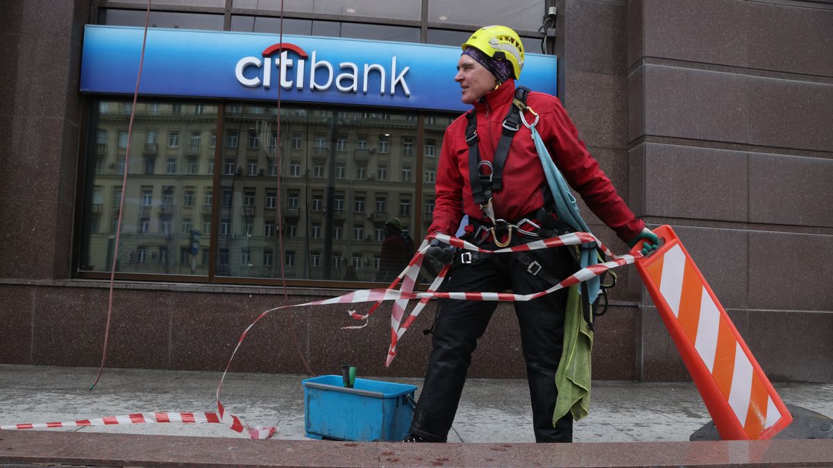 MOSCOW, RUSSIA - APRIL 2:  (RUSSIA OUT) An industrial climber works near a Citibank branch April 2, 2023 in Moscow, Russia. Citigroup announced the termination of services at its subsidiary ZAO Citi Bank Russia for individuals for the foreseeable future due to the Western sanctions. (Photo by Contributor/Getty Images)