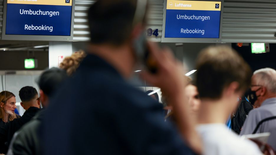 Passengers queue at rebooking counters for Deutsche Lufthansa AG, during a strike by the airline's pilots, at Terminal 1 of Frankfurt Airport in Frankfurt, Germany, on Friday, Sept. 2, 2022. Lufthansa suspended almost its entire flight operations in Frankfurt and Munich because of a strike by pilots who are demanding higher pay, adding another day of major disruptions to what has already turned into a summer of travel chaos. Photographer: Alex Kraus/Bloomberg via Getty Images