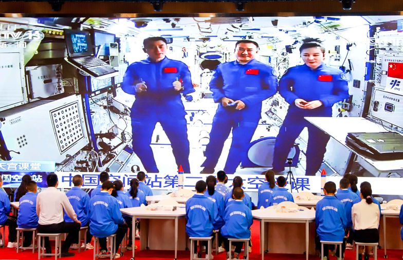 ZHANGYE, CHINA - MARCH 23 2022: Students watch a televised lecture by the three astronauts on the Chinese space station Tiangong in a school in Zhangye in northwest China's Gansu province Wednesday, March 23, 2022. (Photo credit should read XUE LEI/Future Publishing via Getty Images)